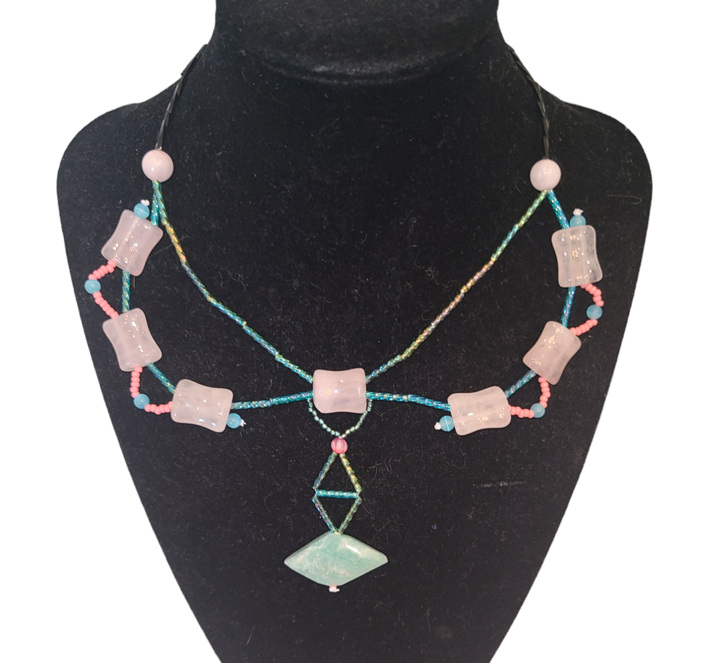 Dramatic teal and pink Y-shaped necklace featuring rose quartz beads and an amazonite bead at the center.