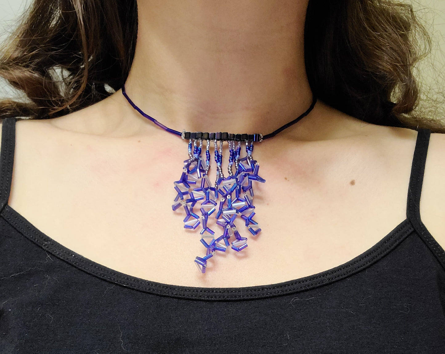 Woman wearing cobalt diamond fringe necklace