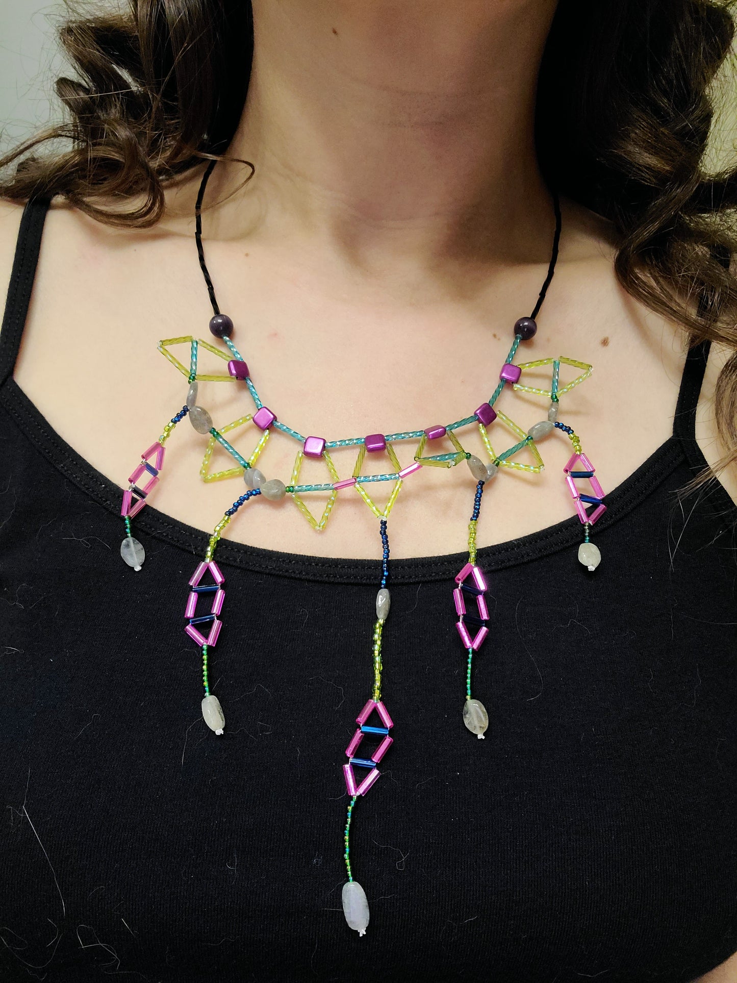 Woman wearing labradorite kaleidoscope statement necklace