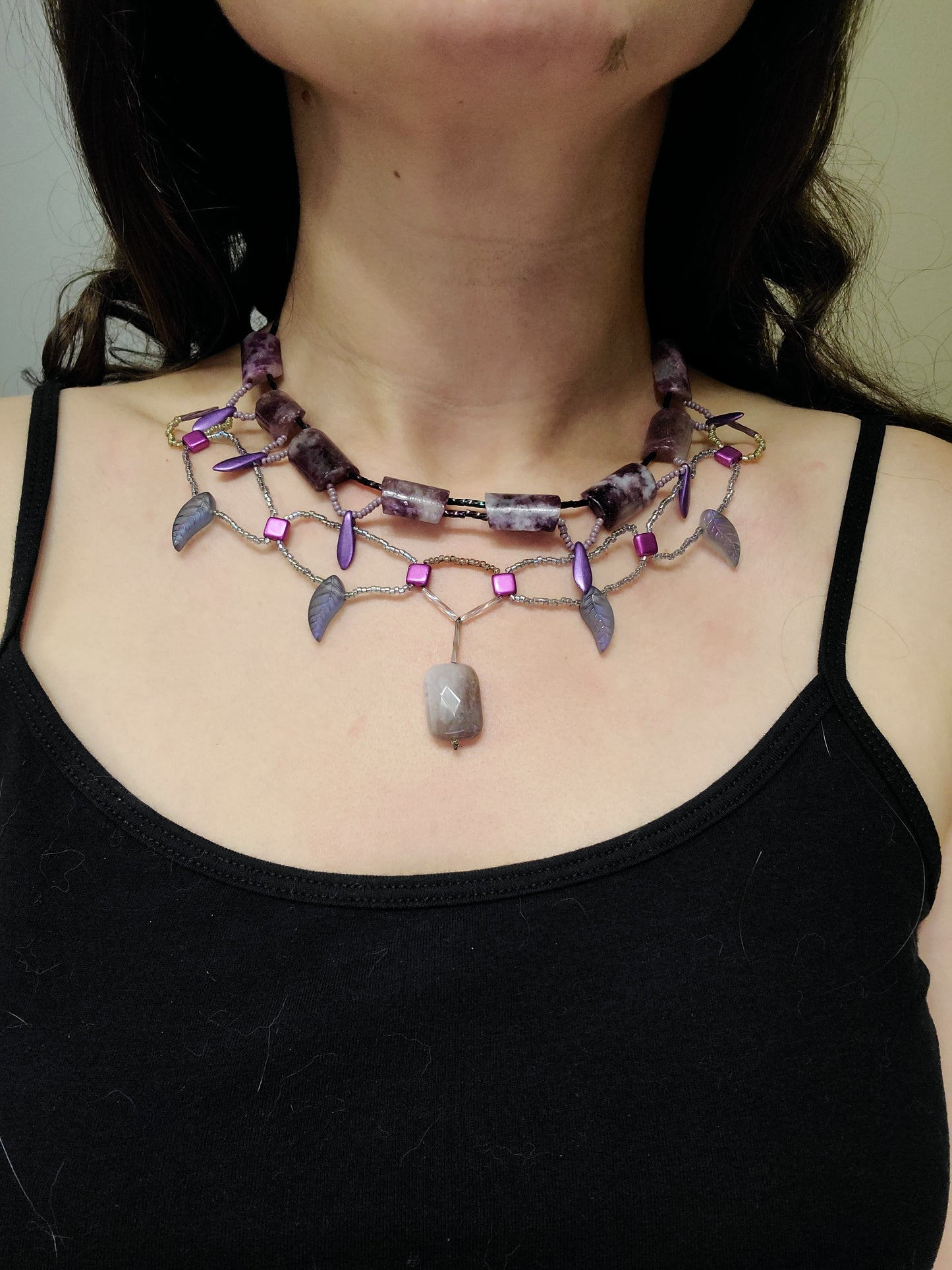 Woman wearing purple lepidolite statement necklace