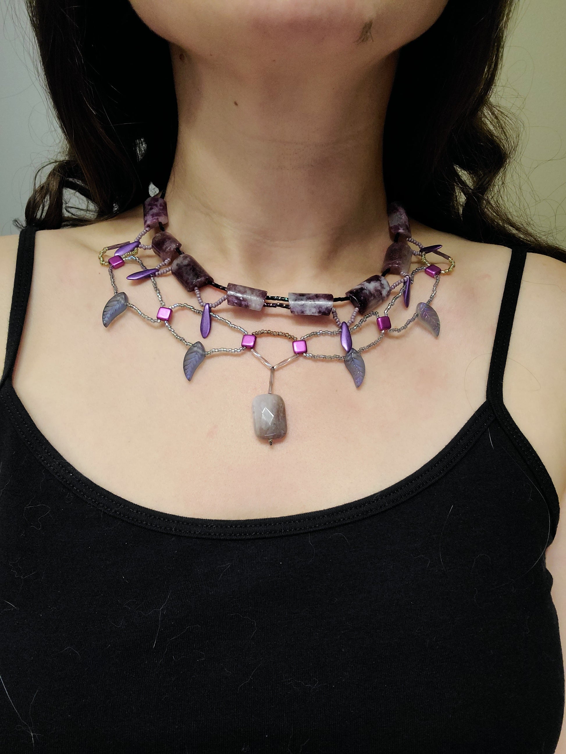 Woman wearing purple lepidolite statement necklace