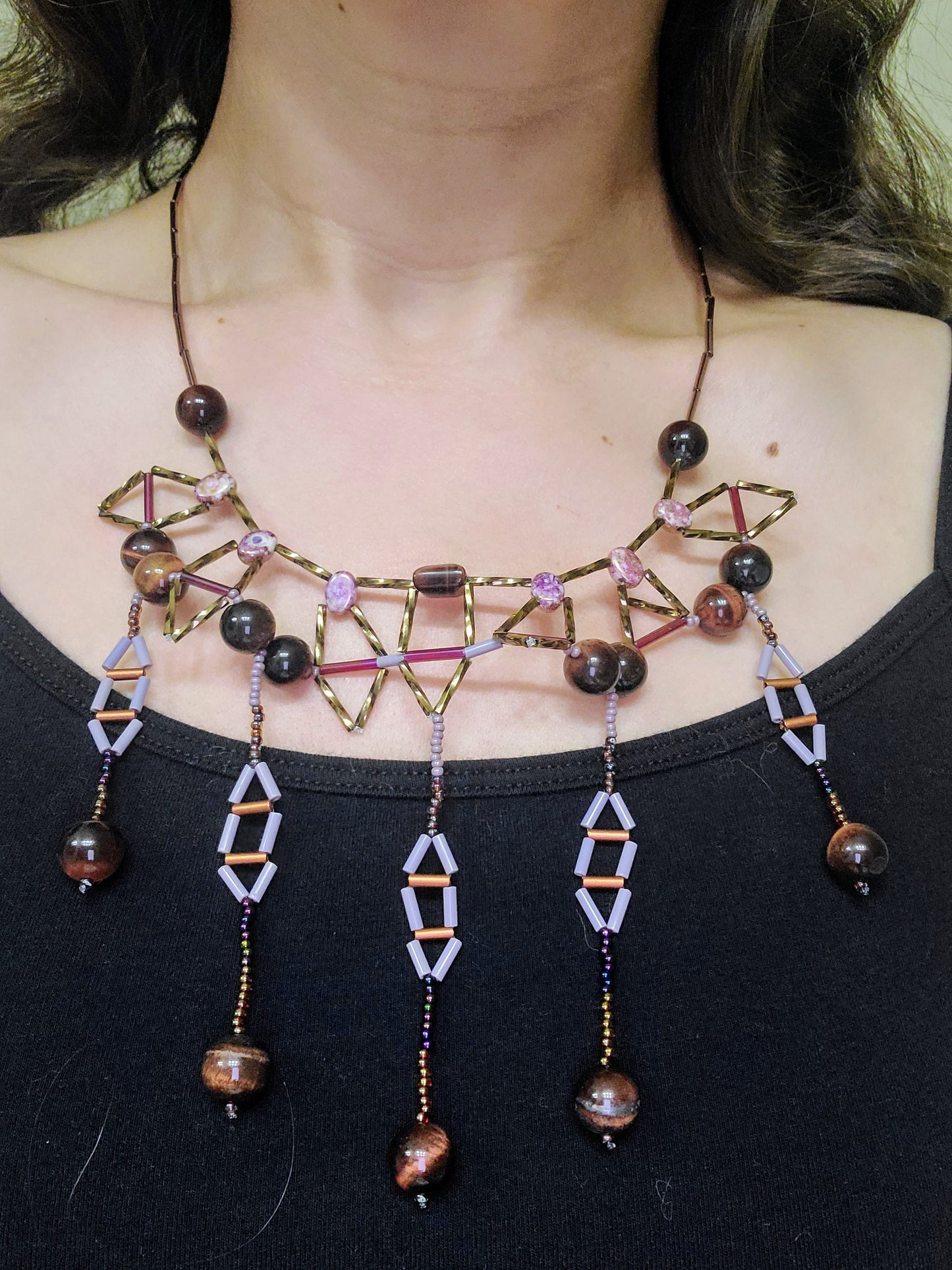 Woman wearing beaded red tiger eye statement necklace