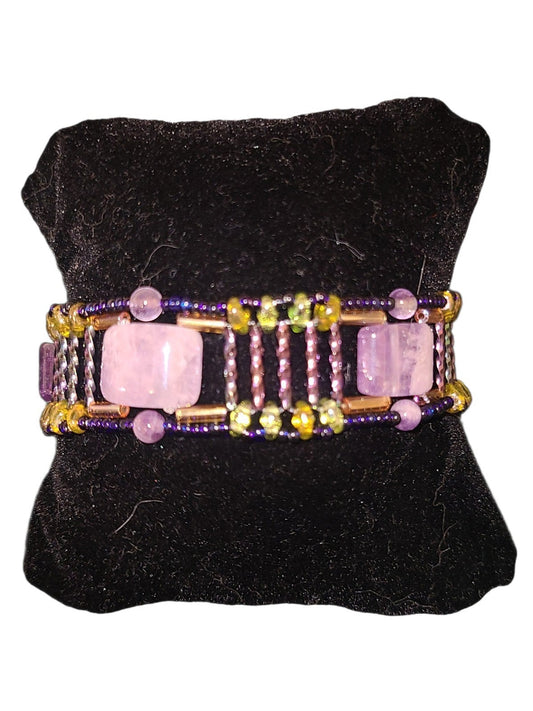 Wide amethyst beaded cuff with segmented Roman road construction, amber glass columns, deep navy border, gold junctions