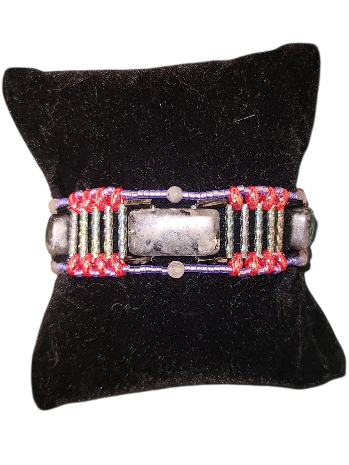 Wide black labradorite beaded cuff with segmented Roman road construction, gray columns, blue-violet border, red glass junctions