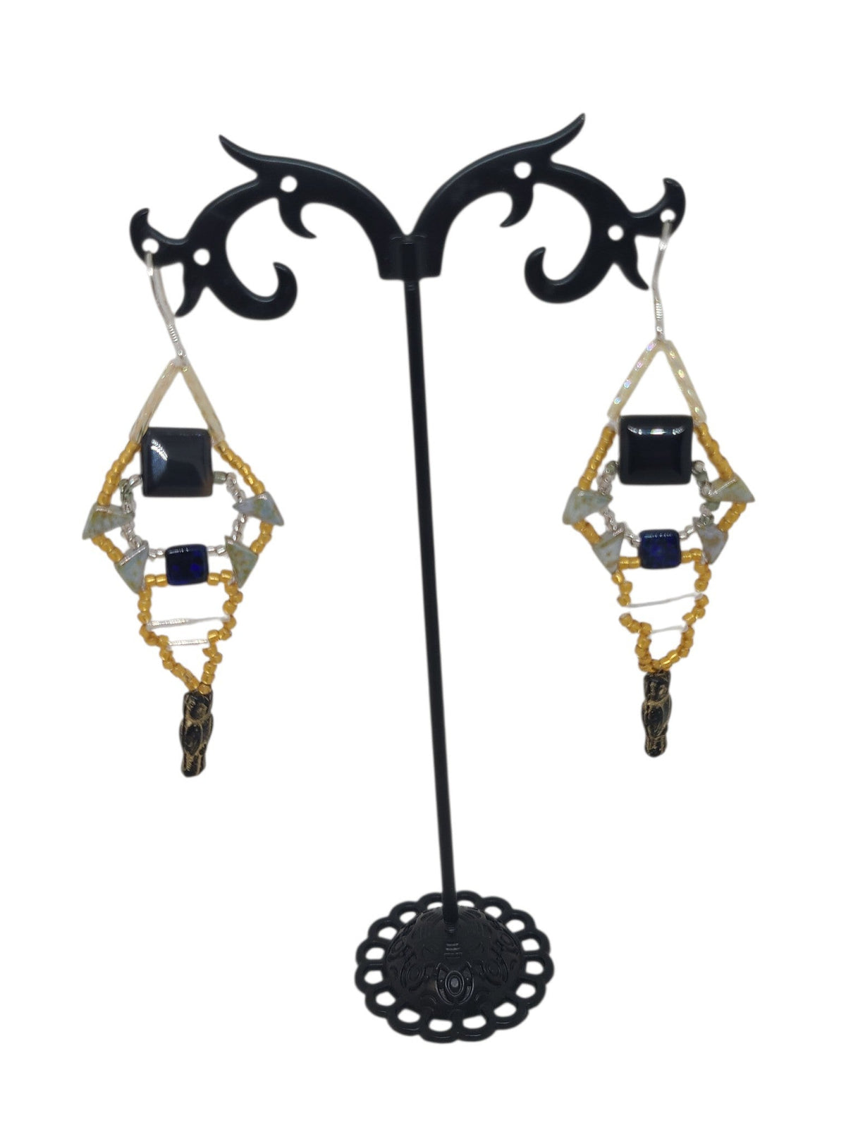 Black onyx beaded girandole earrings in gold and black diamond spindle form with glass owl drop, front view
