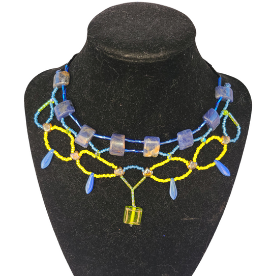 Blue and yellow sodalite necklace with bottle green statement bead. 