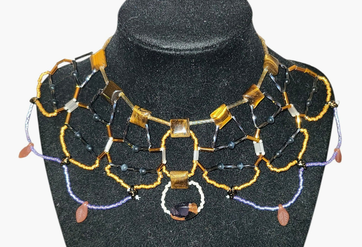 Geometric tiger eye beaded statement necklace with gunmetal framework and goldstone focal drop, Tsuga Beadwork